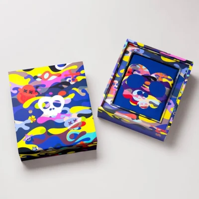 ilakh multicolor collector’s box with camo skull design and matching blue T-shirt