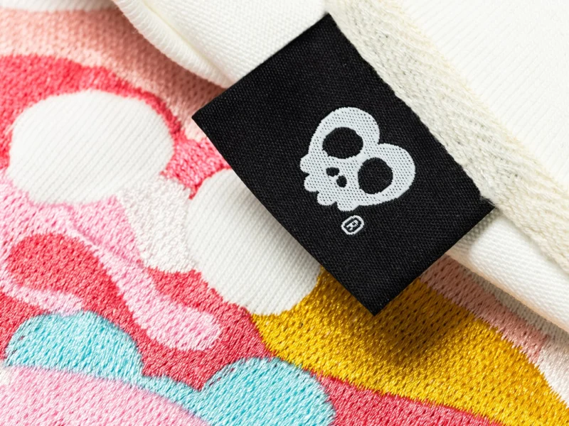 ilakh brand detail stitched onto T-shirt
